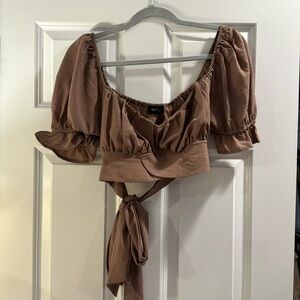 Brown short sleeve crop top with tie in the back